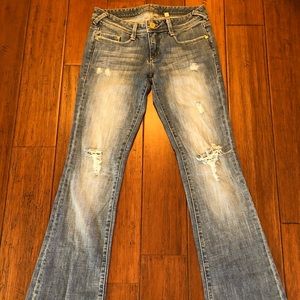 Bebe light wash distressed bootcut jeans